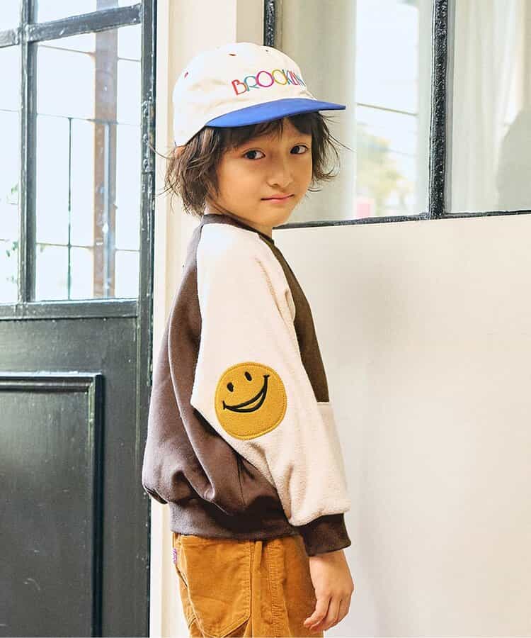 エルボーパッチラグラントレーナー